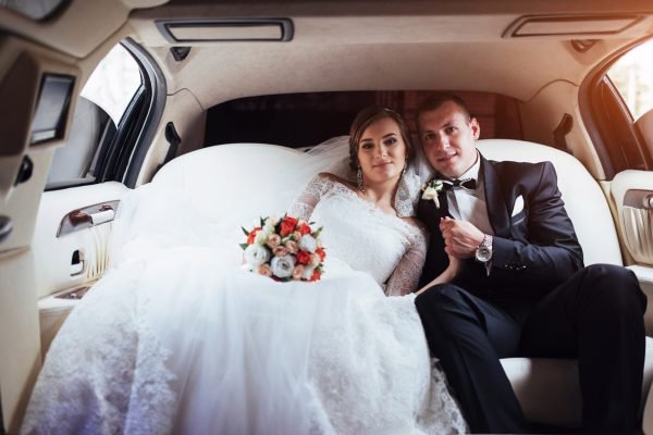 young couple in a car in wedding day young couple in a car in wedding day.